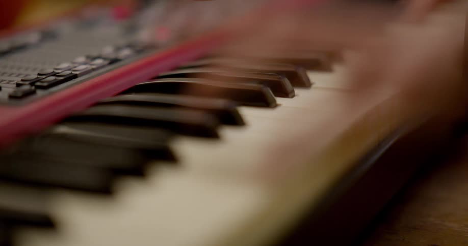 Timelapse footage of some one playing a keyboard