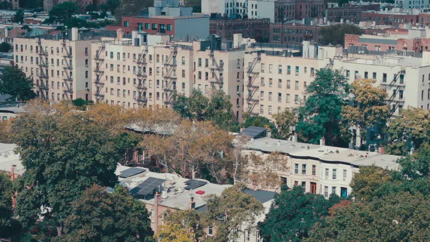 Aerial panorama of residential buildings with bushes around during the day
