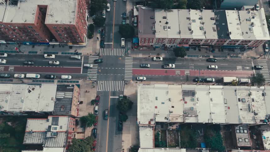 Traffic moves through an intersection in a suburban area