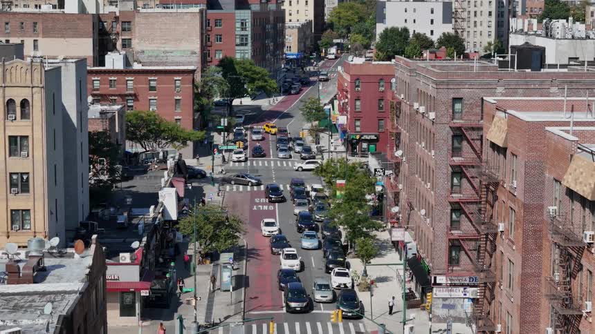 Panorama of an urban city with a busy street with vehicles and pedestrians
