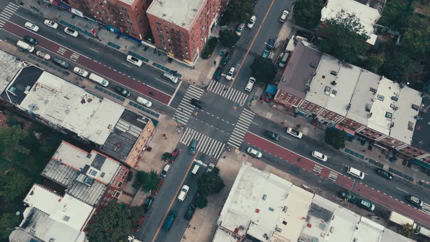 Aerial panorama of an urban city with an intersections having vehicle traffic