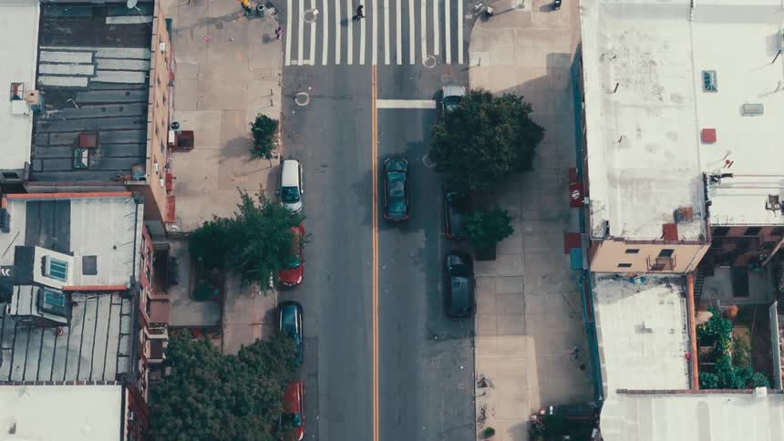 Aerial panorama of an urban city with intersections and vehicle traffic in day