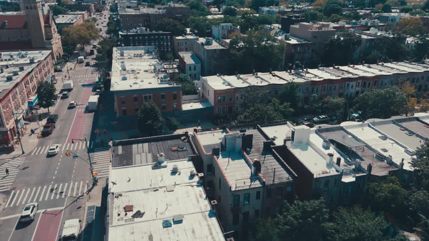 Aerial scenery of residential buildings of an urban city and intersections with vehicle traffic