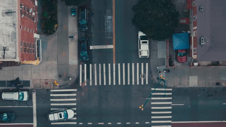 Aerial panorama of an urban city with intersections and vehicle traffic