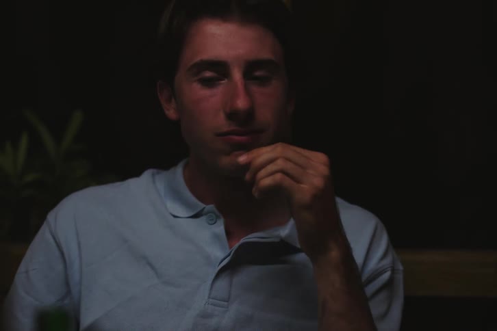 Portrait of two friends sitting eating and smoking while talking