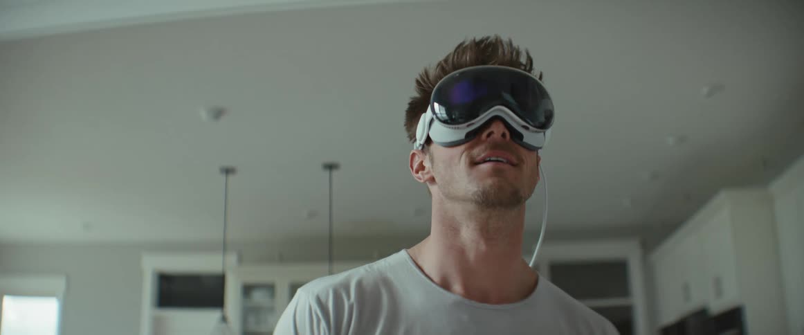Man wearing vr headset indoors turns his head while using it
