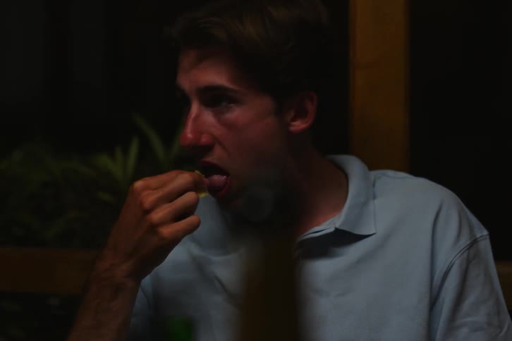 A group of people eating food at a table