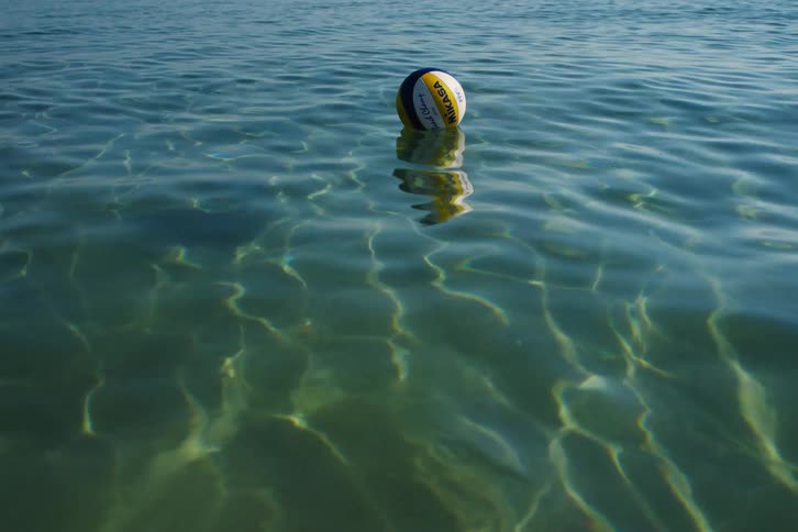 A ball floats on water