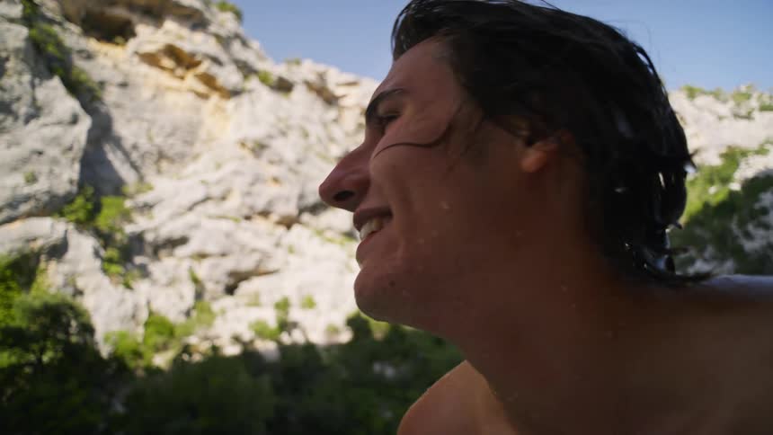 Portrait of two young friends talking while on a boat traveling on a peninsula