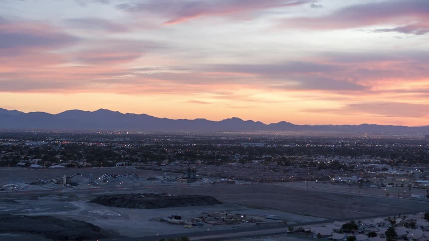 A city with suburbs near a mountain range