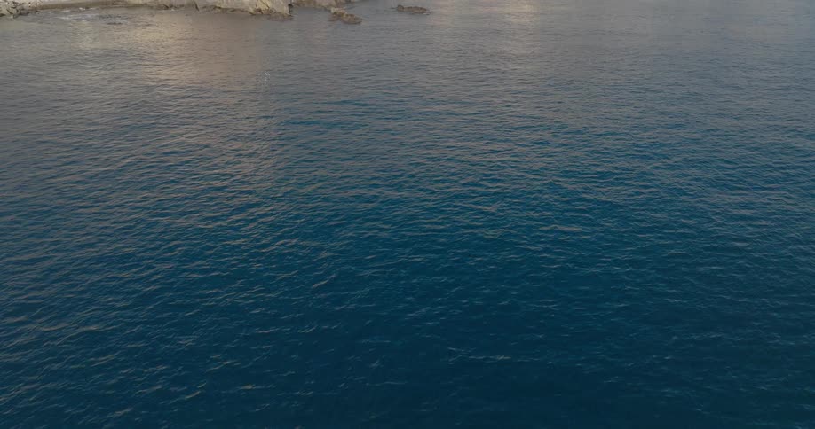 Aerial panorama of the sea at the edge of a city