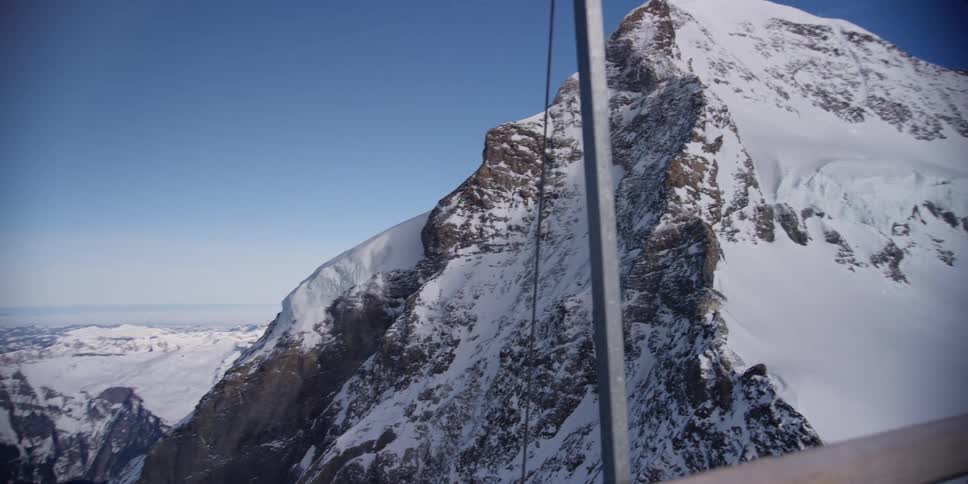 Footage of a mountain range taken from the jungfrau railway in switzerland
