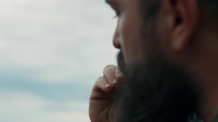 A man eating some food outdoors