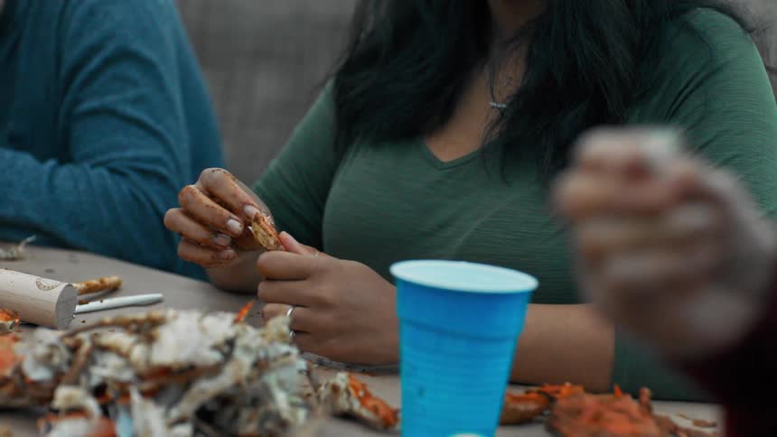 People are eating crab outside