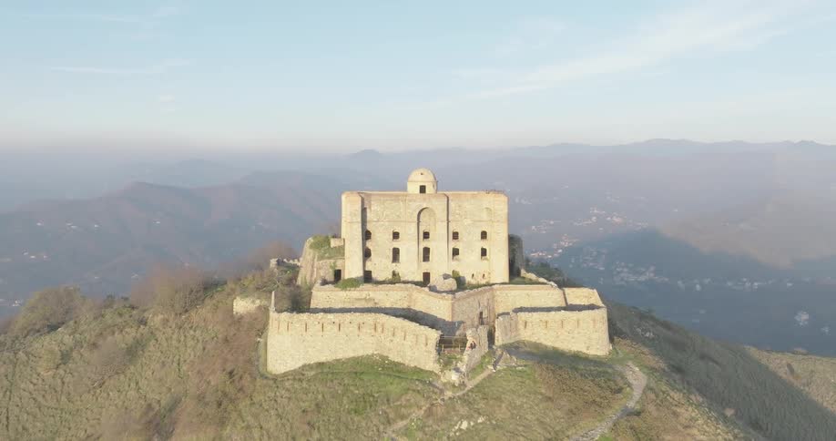 An old building sits on top of a mountain