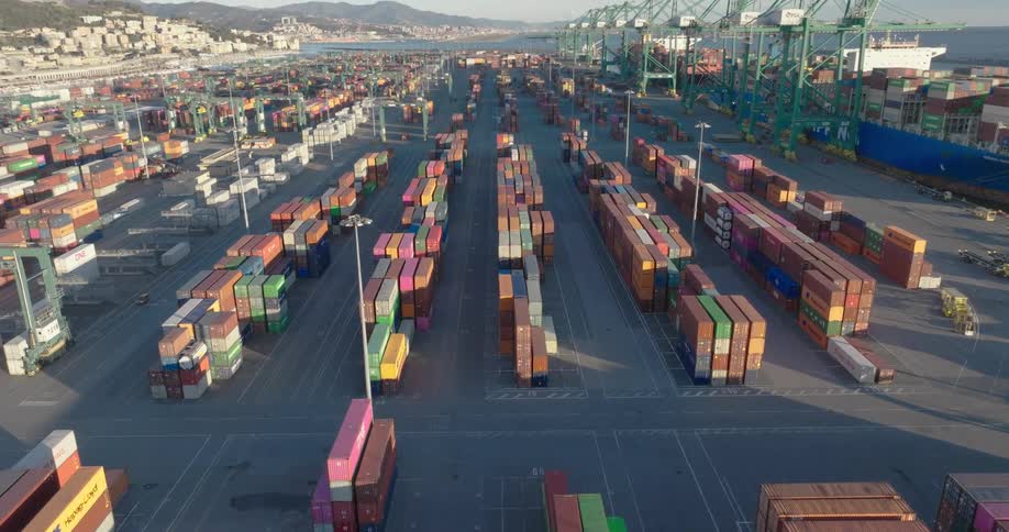 Aerial panorama of a port with containers and cargo ships alongside