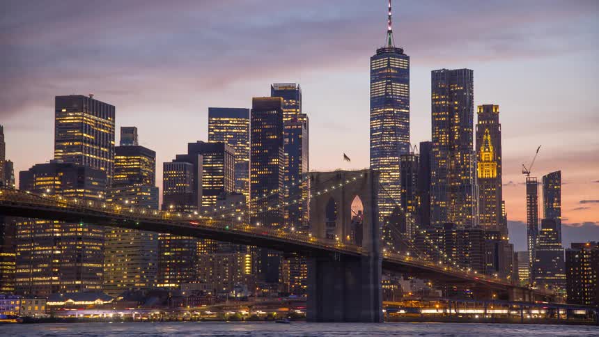 Time lapse footage of the new york city skyline and brooklyn bridge day night cycle