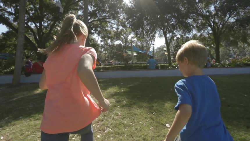 Kids running in the grass