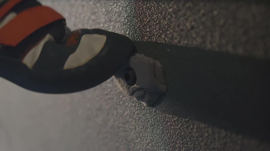 Foot of a person training on a climbing wall