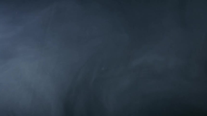 A thin white smoke on a black background