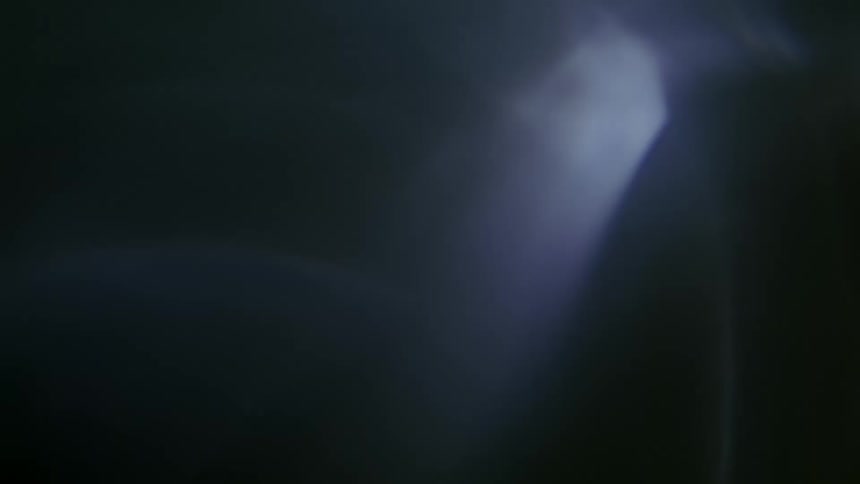 Abstract flowing refraction of light on darkness