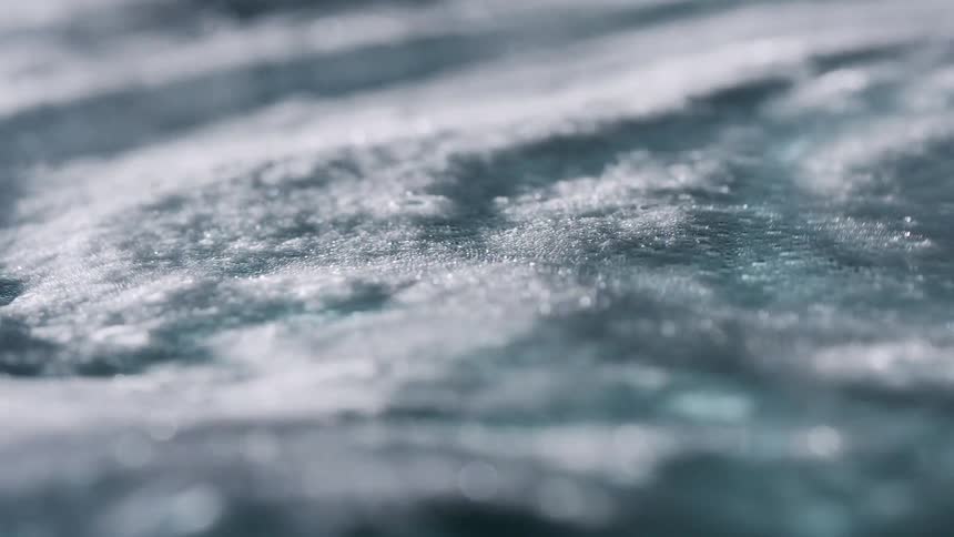 A foamy liquid flows