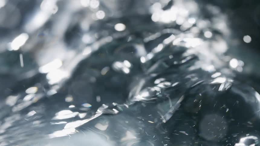 A surface of a transparent liquid moving intensely