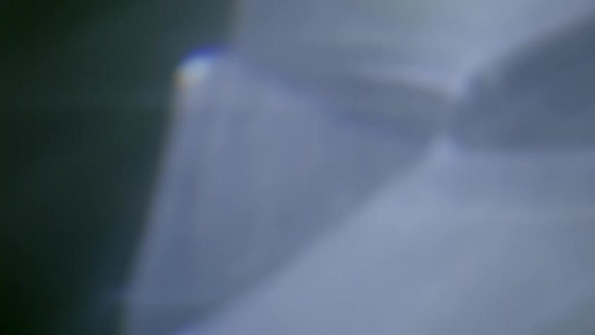 Beams of light are refracted to create blurry abstract imagery