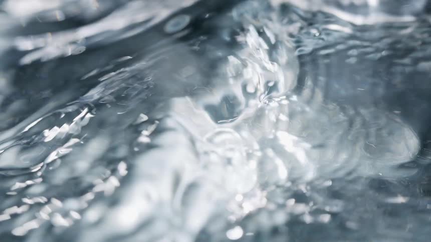 Closeup of ripples on the surface of clear water