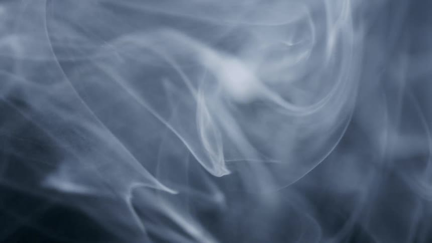 A cloud of smoke moving in waves