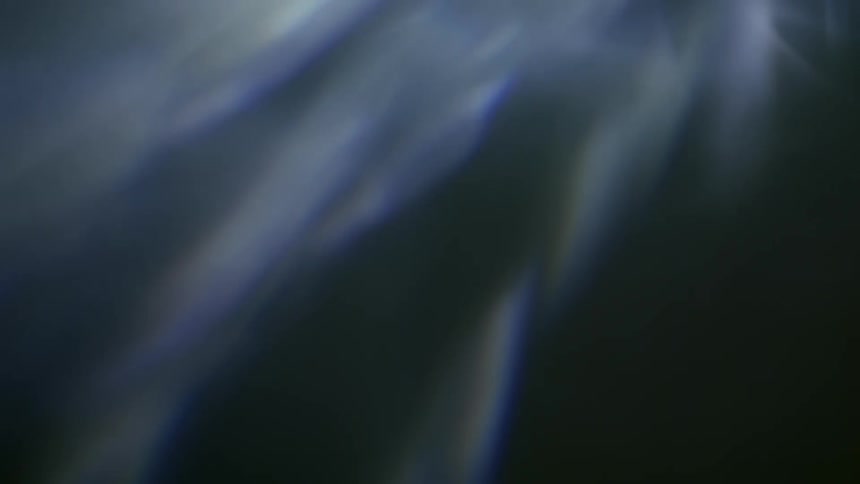 Multiple beams of white light appearing on a surface
