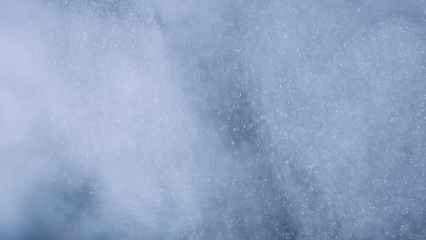 A cloud of dust particles moving in waves