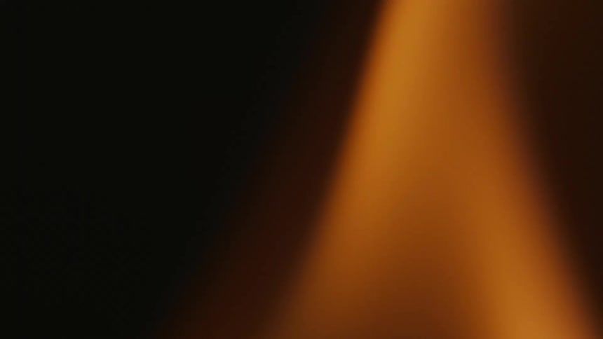 Extreme close up on fire flame at night