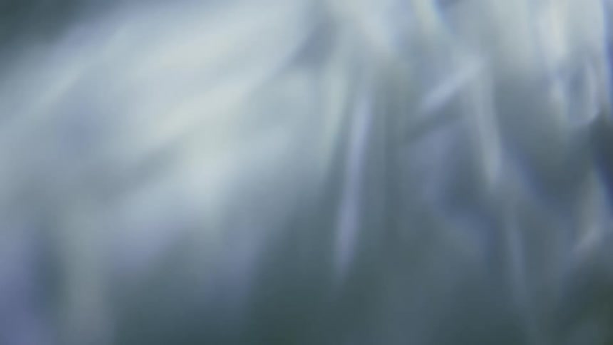 Soft colored light is blurred and refracted to create abstract scenery