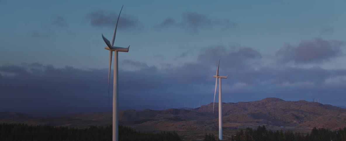 Turbines on wind power towers in natural fields on a morning