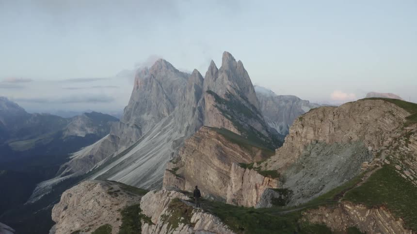 Aerial panorama of mountains with cliffs and peaks in a morning