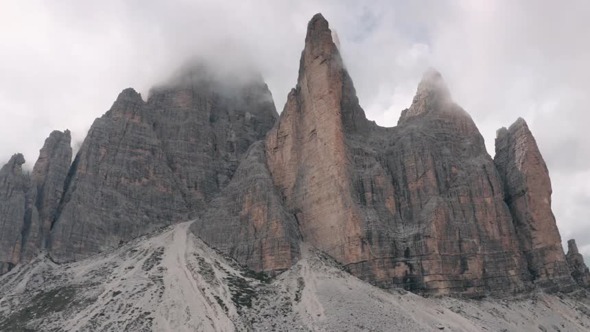 A mountain range wreathed at the top with clouds