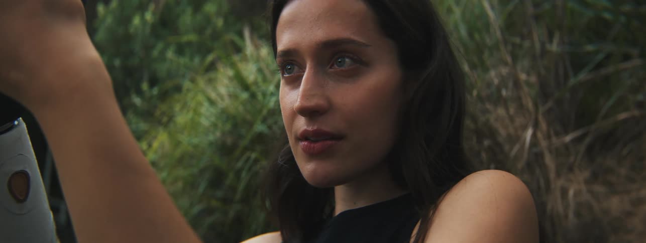 Closeup of a womans face with beautiful blue eyes admiring nature