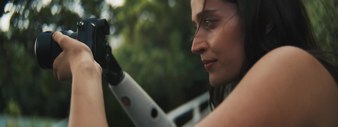 A clip of a lady wielding a camera