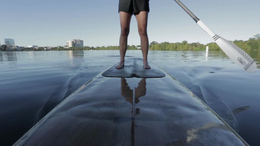 A woman paddling a paddle board