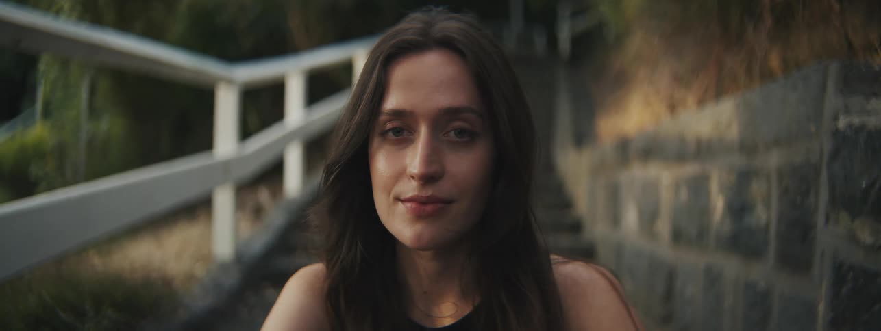 Closeup of a womans face outdoors during sunset