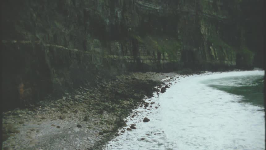 The waves crash against the shore