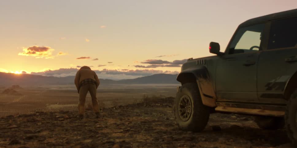 A man watches the sunset on the landscape