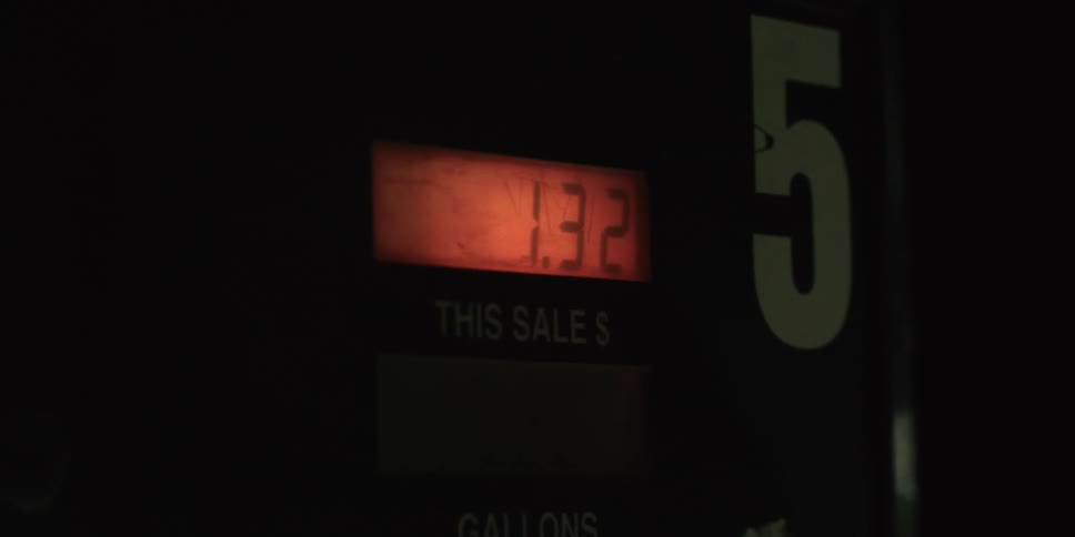 Closeup on a gas pump with the number increasing