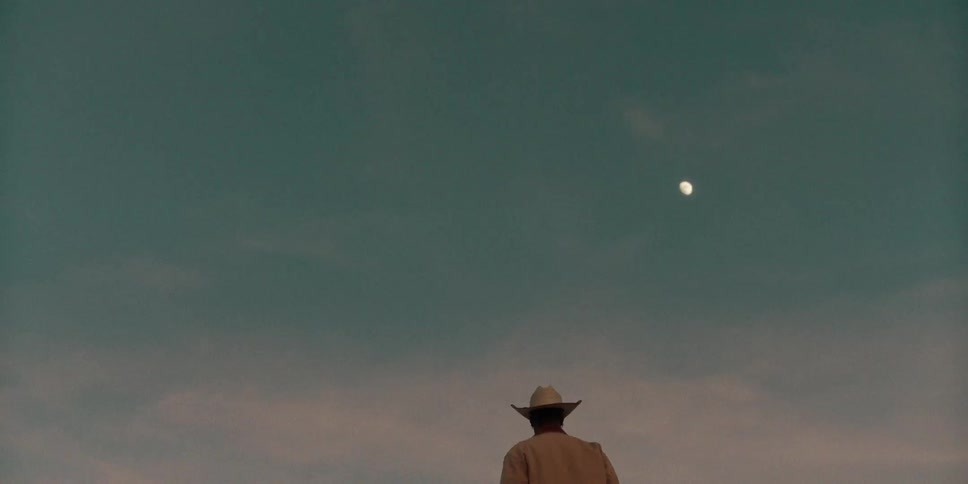 A man is watching the sunset