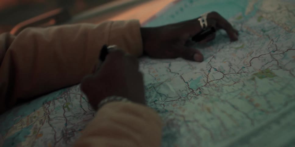 A person draws a circle on the map