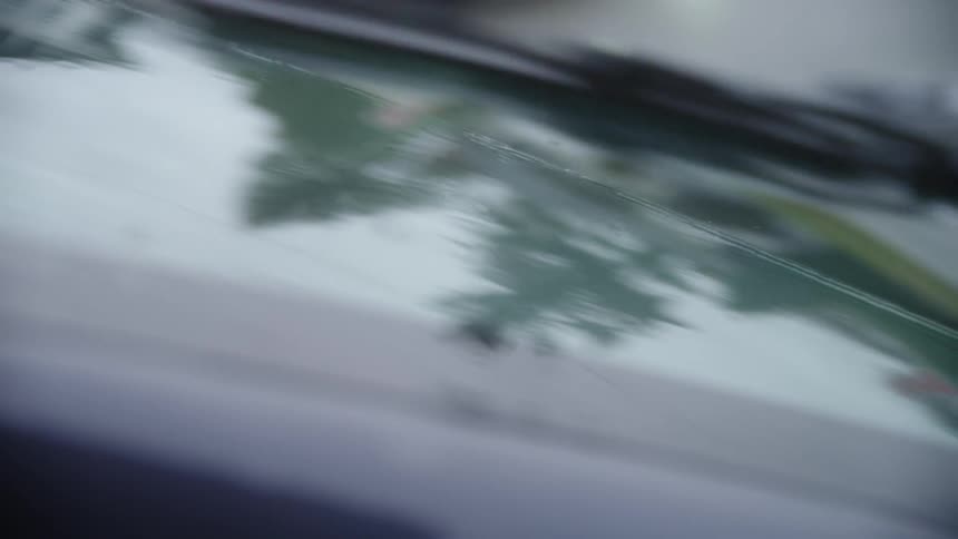 Rain is pouring on the windshield