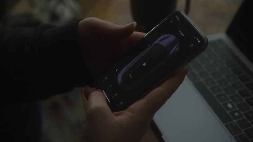 A white person swipes on a smartphone