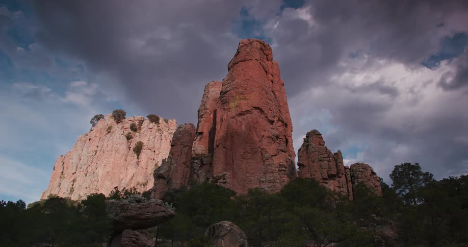 Mountains tower over a forested area