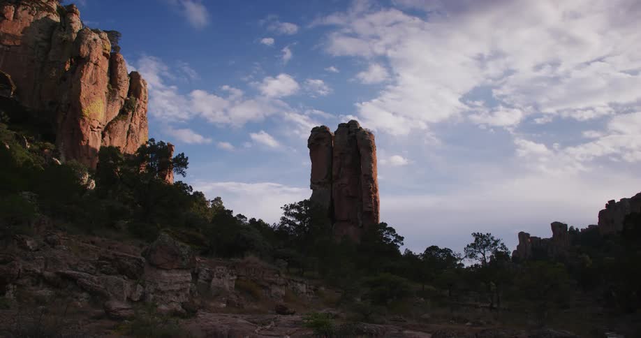 A rocky monument stands tall in the wilderness